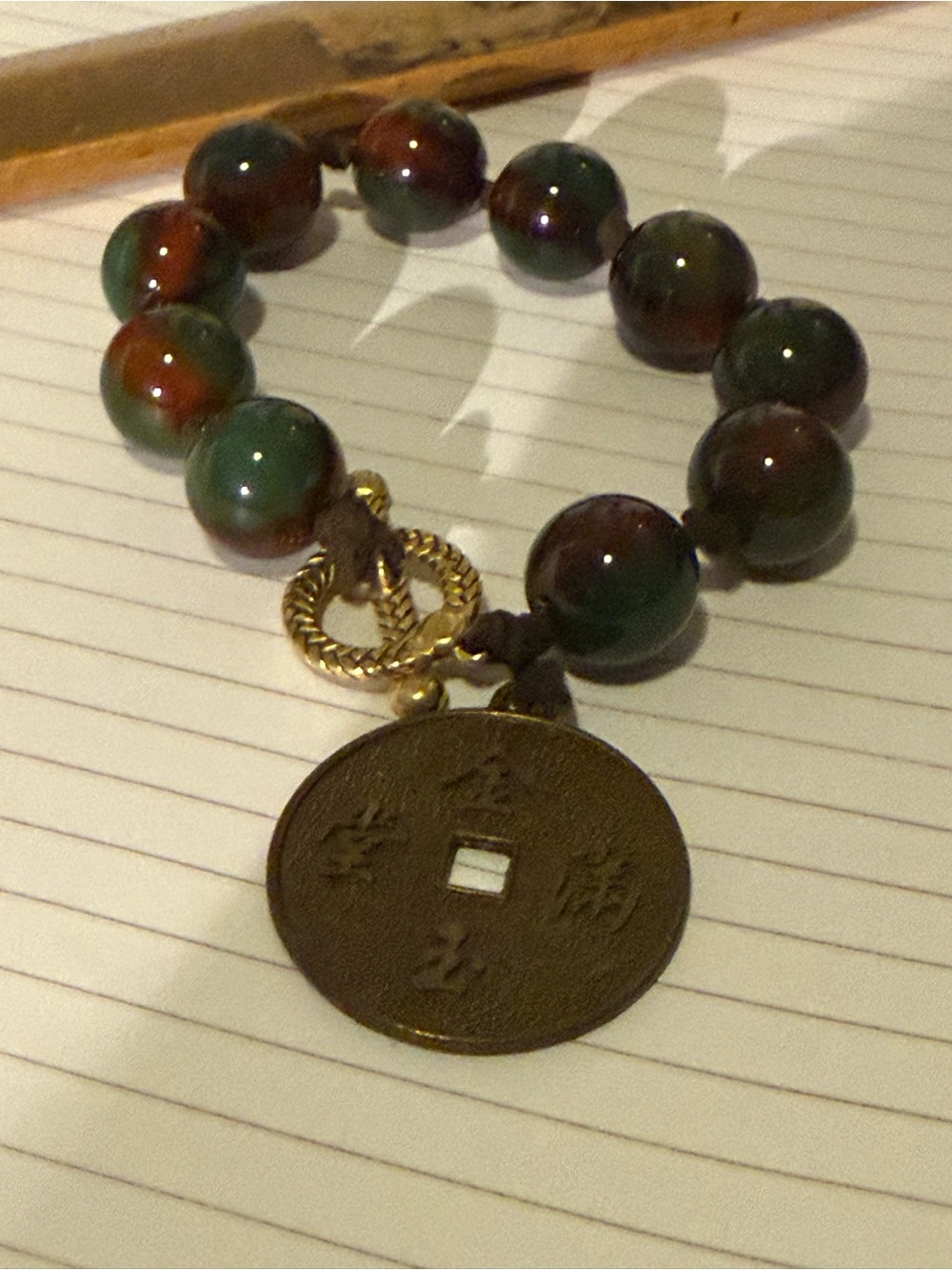 Green and Brown Beaded Bracelet with Coin Charm